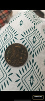 Collectible Coin with Standing Figure and Architectural Design - Image 2