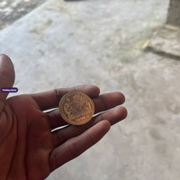 Thai Collectible Coin with Seated Royal Figure and Temple Design