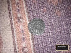 Islamic Collectible Coin with Arabic Calligraphy and Circular Border