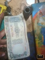 India 100 Rupees Banknote with Agricultural Scene and National Emblem