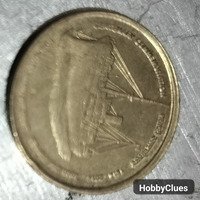 Vintage Commemorative Coin Featuring Historic Ship Design